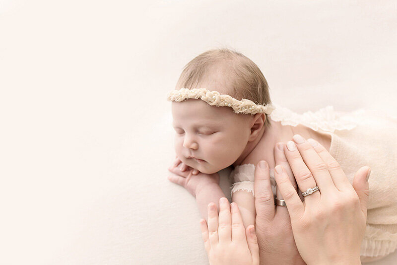 Cleveland newborn photography of parents hands on their new baby
