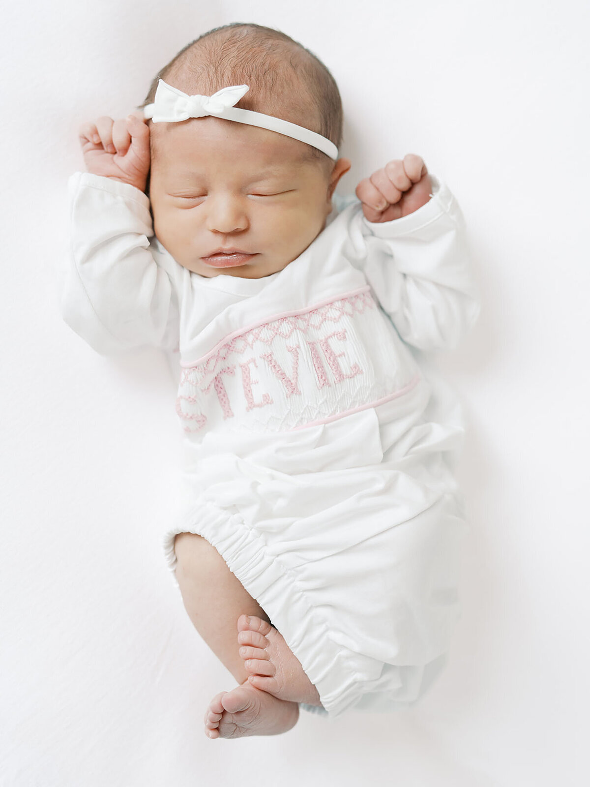 A sweet newborn baby girl during an austin newborn session