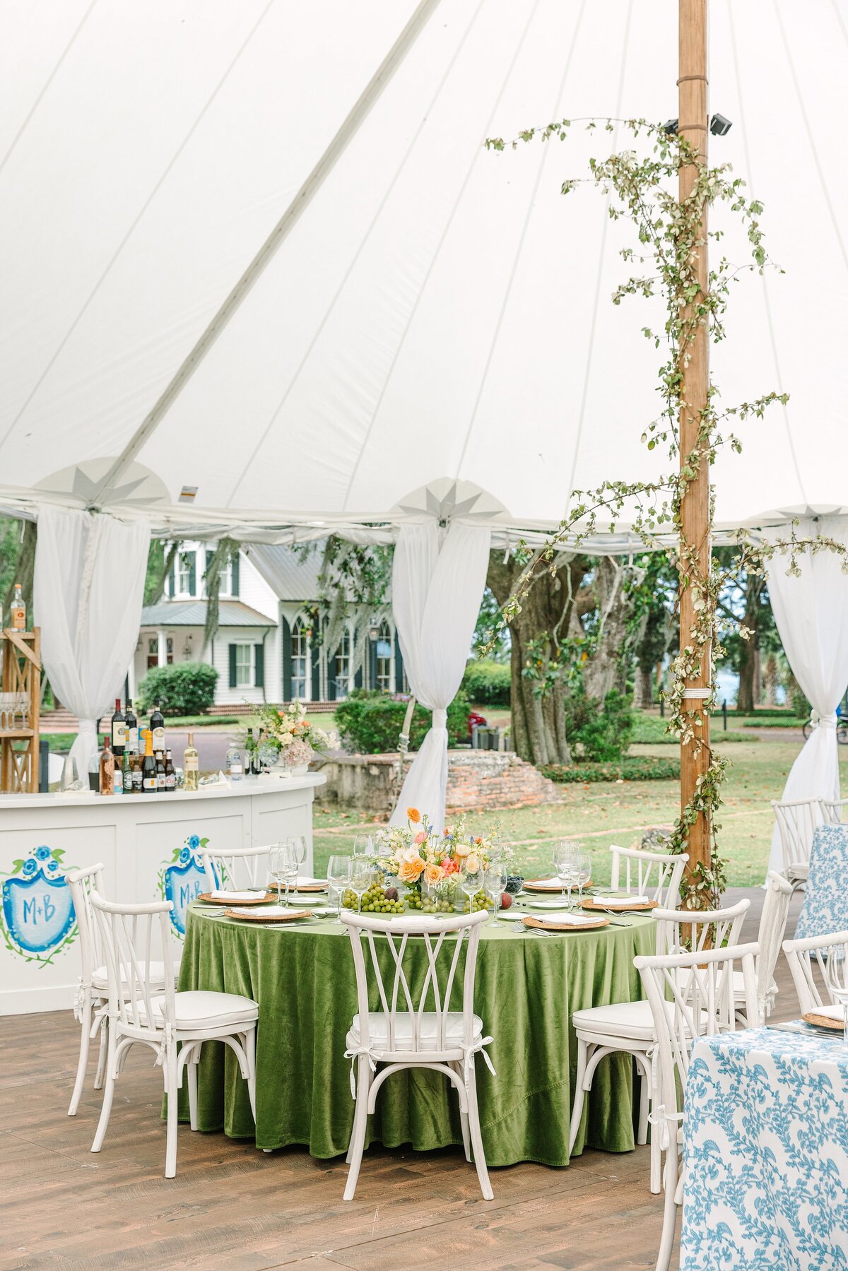 colorful tables under a sail cloth tent at palmetto bluff