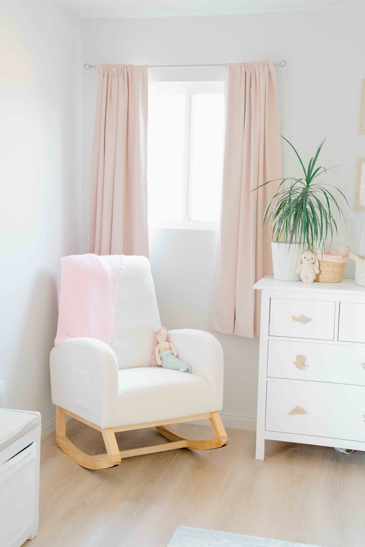 Pink and white baby nursery for San Diego home