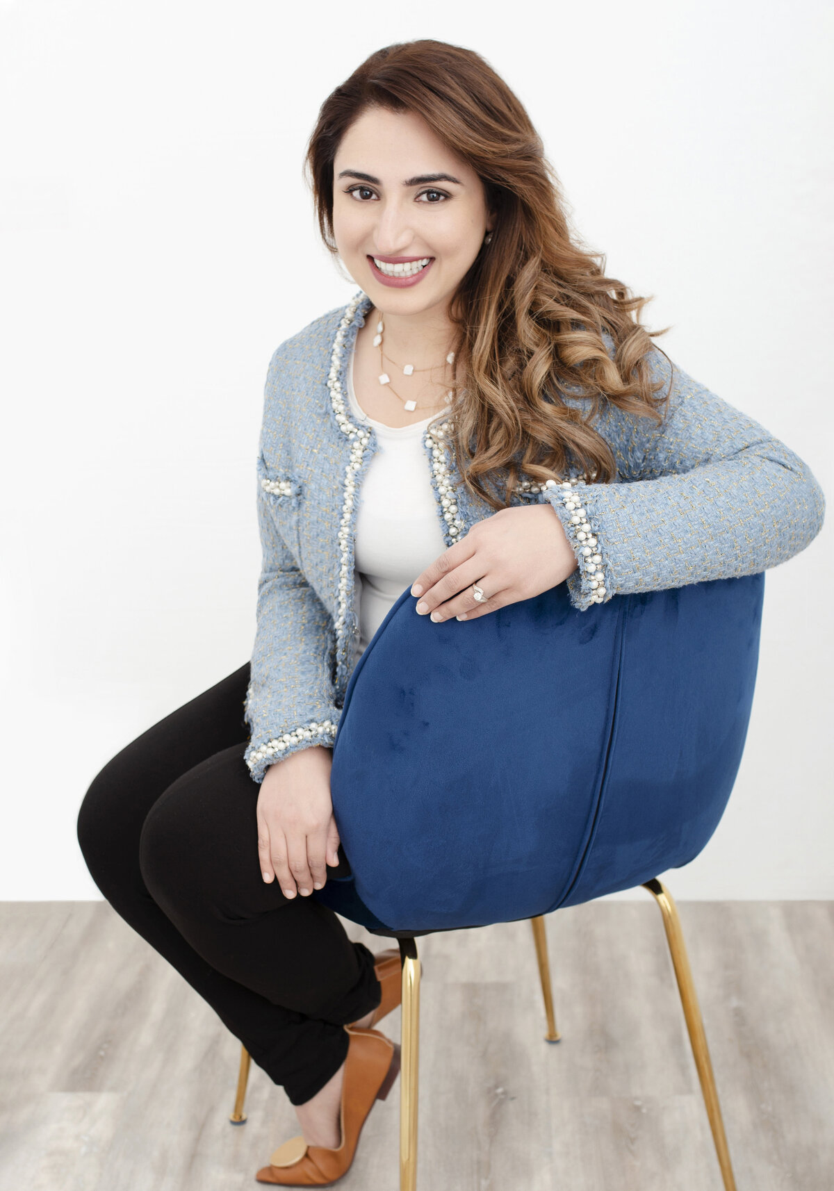 brand marketing strategy for small business- brand strategy- brand strategist - marketing plan - digital marketing agency woman sitting on chair  headshot