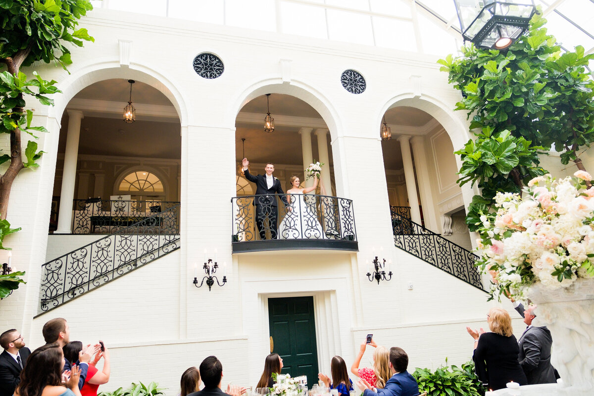 bride and groom waving as they are introduced to their wedding reception at fox chapel golf club