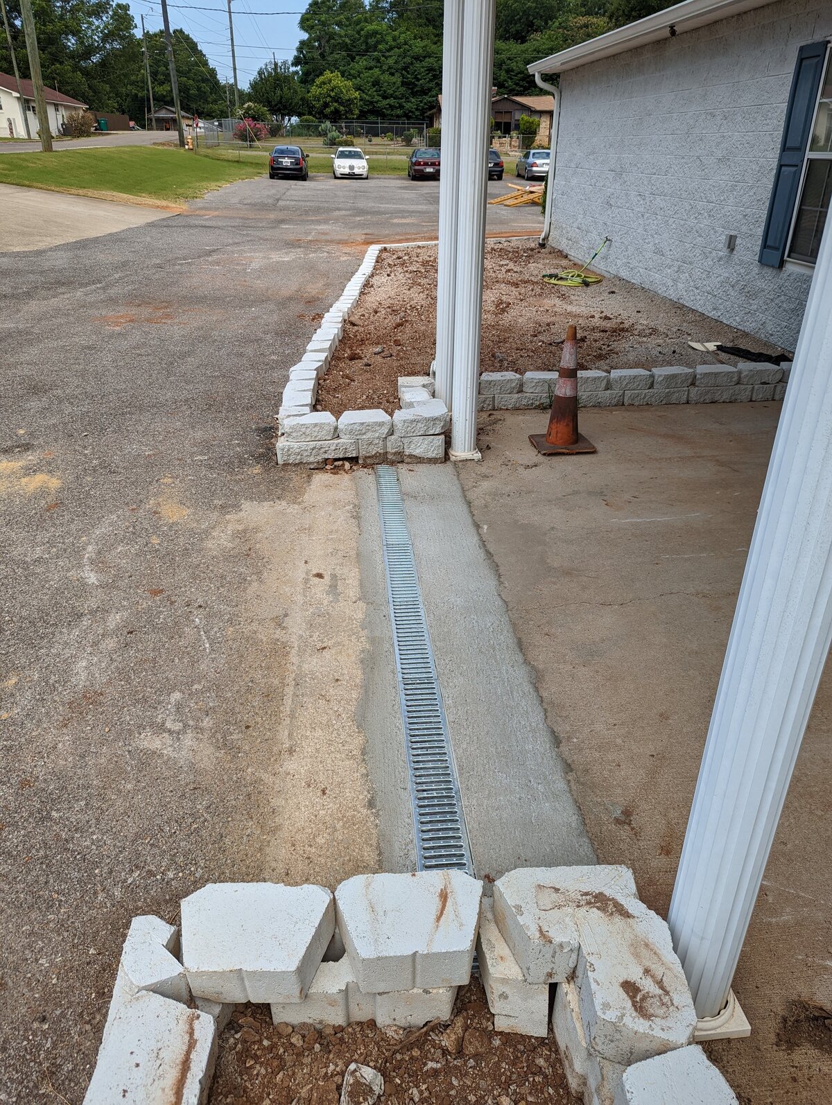 concrete-walkway-with-drain-in-parking-lot
