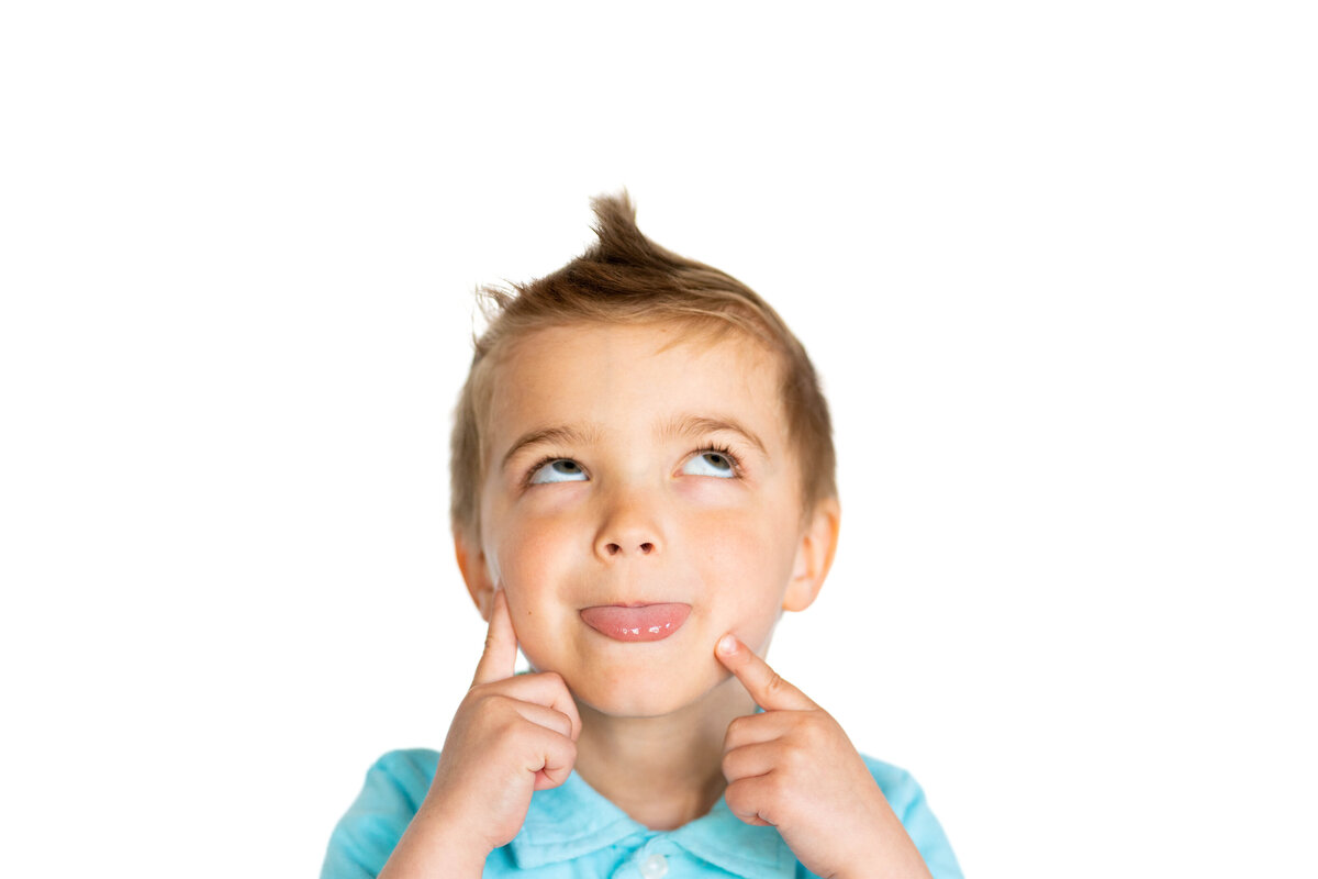 LIttle boy with mohawk looking up