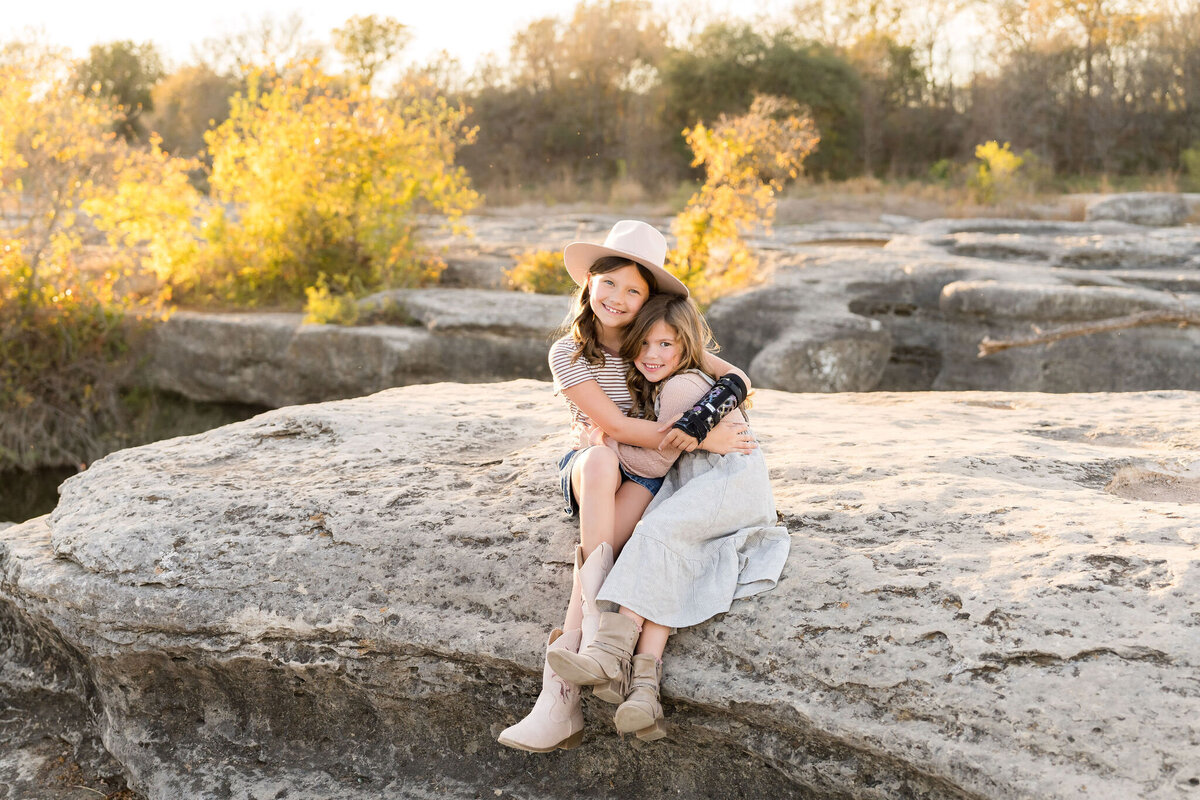 Siblings playing at McKinney Falls State Park in Austin, Texas