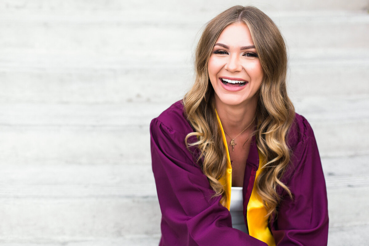 college senior ASU girl smiling with steps