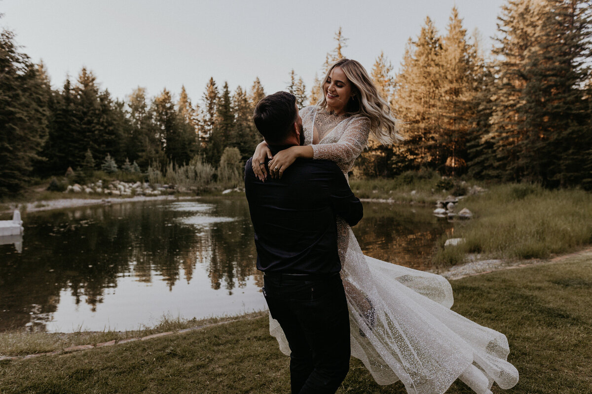 groom picking up and spinning bride around