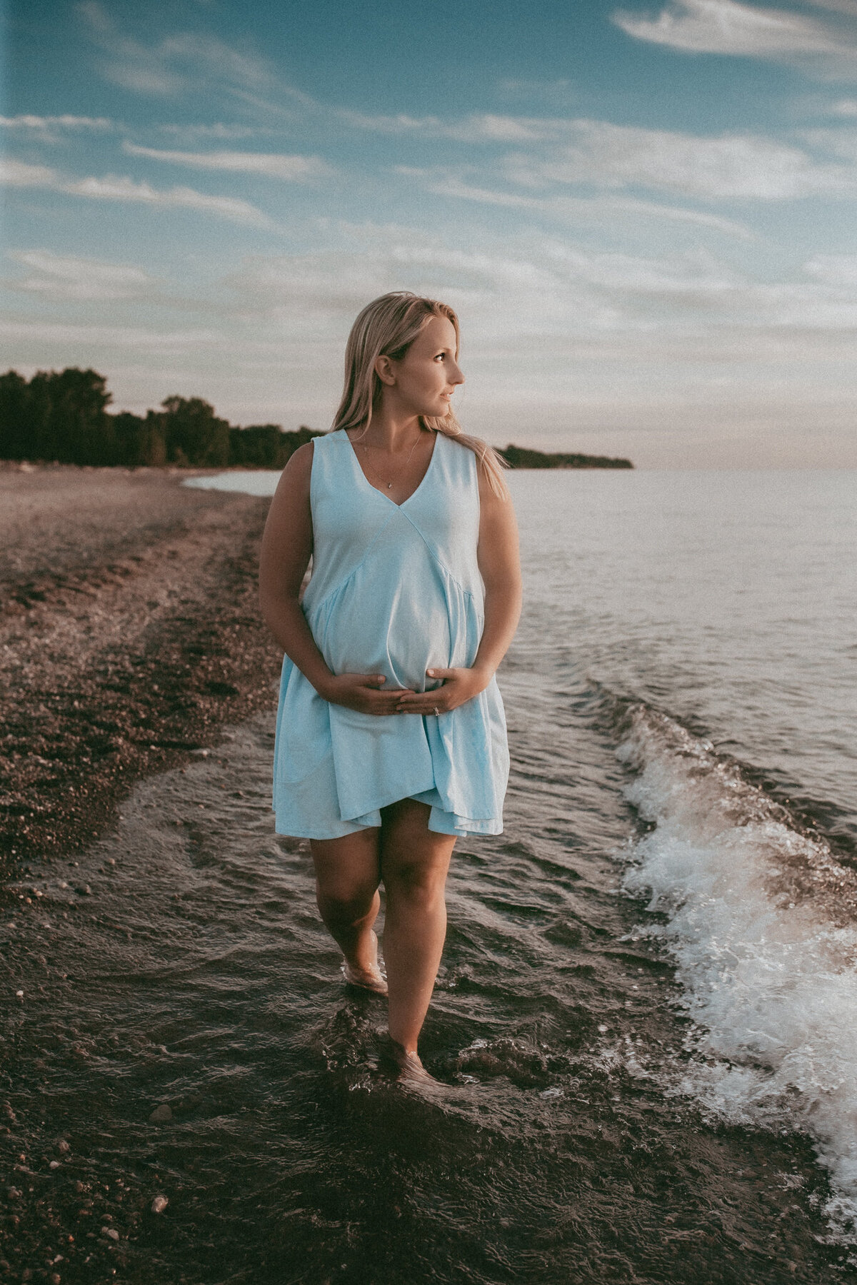walking and cradling baby bump