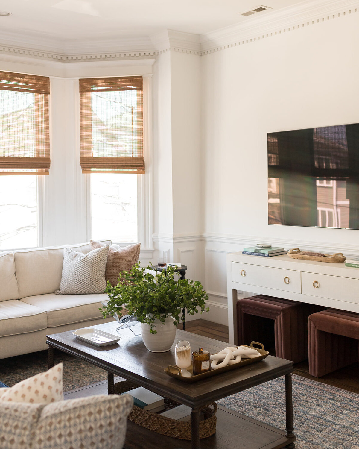 melinda chesson interiors boston living room with dark wood coffee table and rug