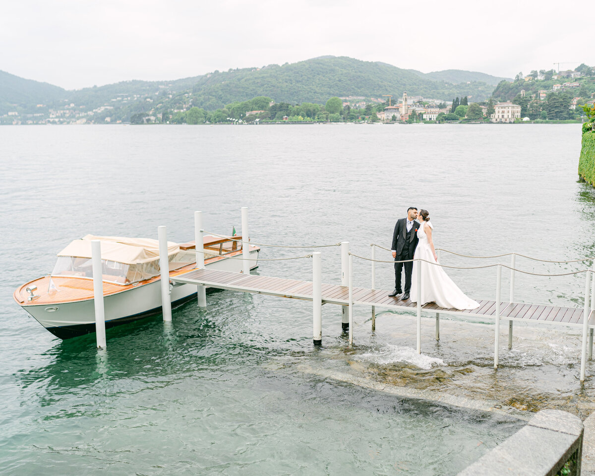 Bride and groom on the pier at Lake Como