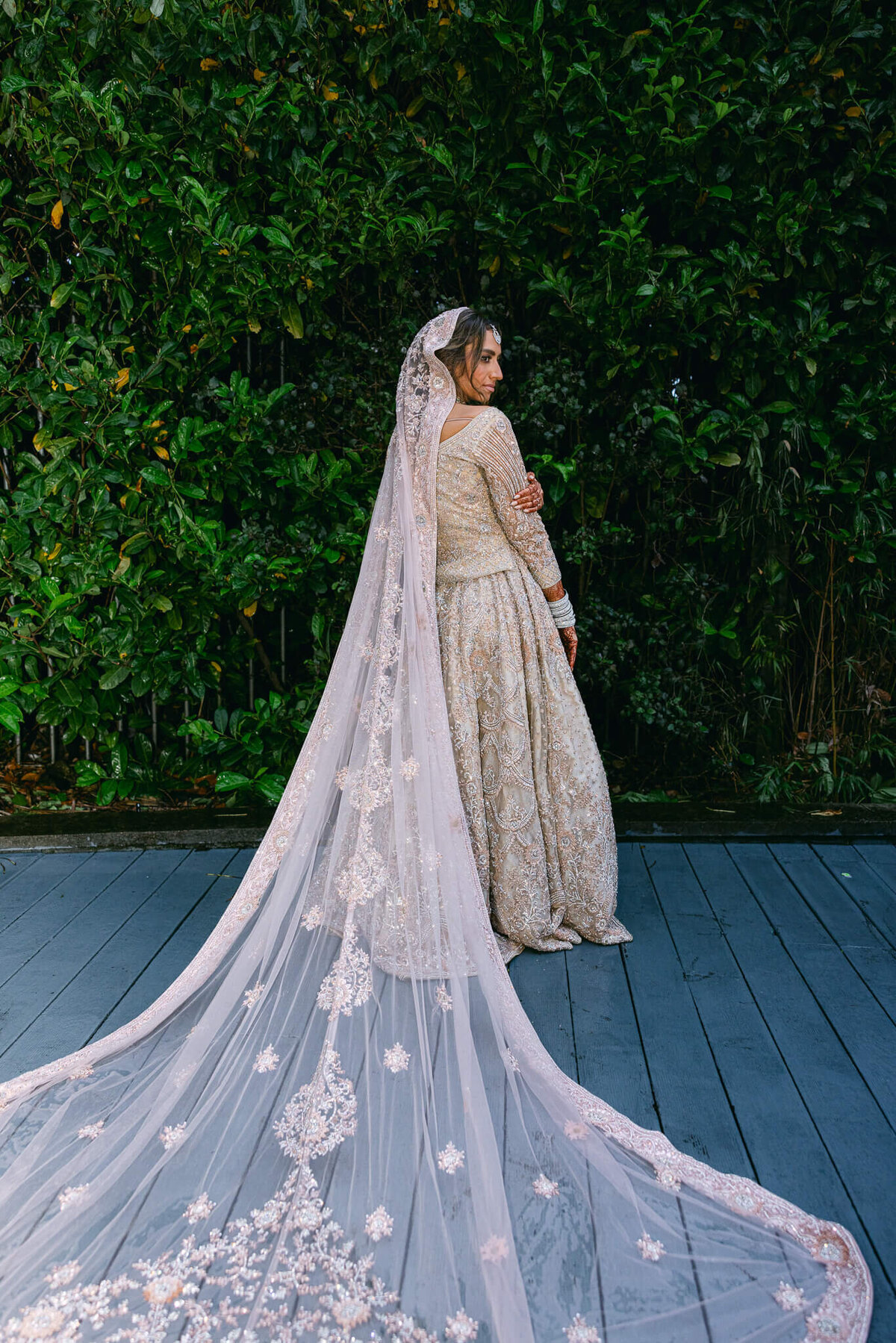 A wedding photo of the bride in her dress showing off the length of her wedding train on her dress in Dublin Ireland.