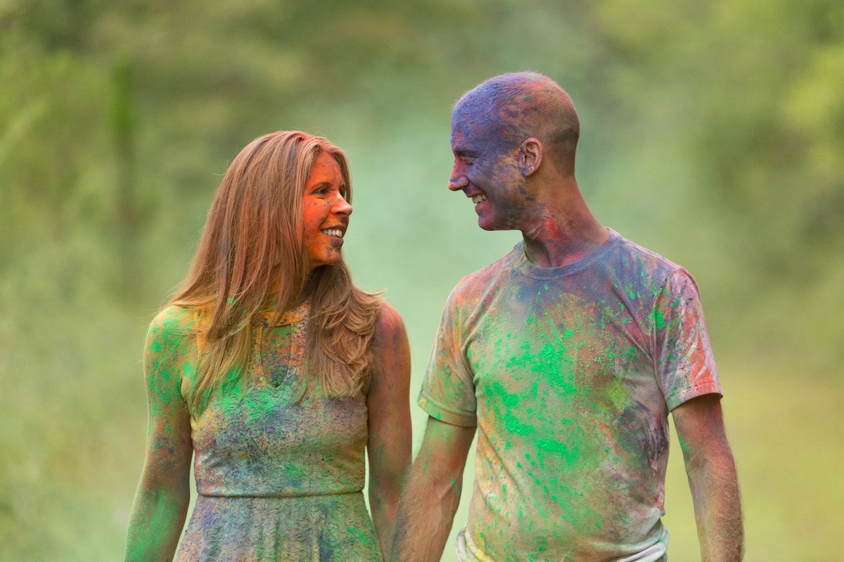Ashley Tipton and Alex Gallusi enjoy a walk together during their engagement session after using India Ink powder.