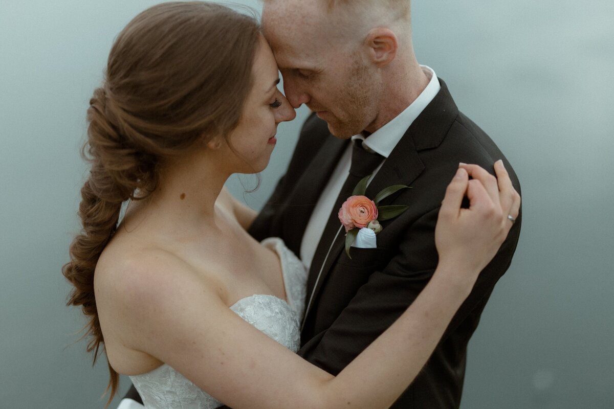 bride and groom hold each other close during their Newfoundland elopement