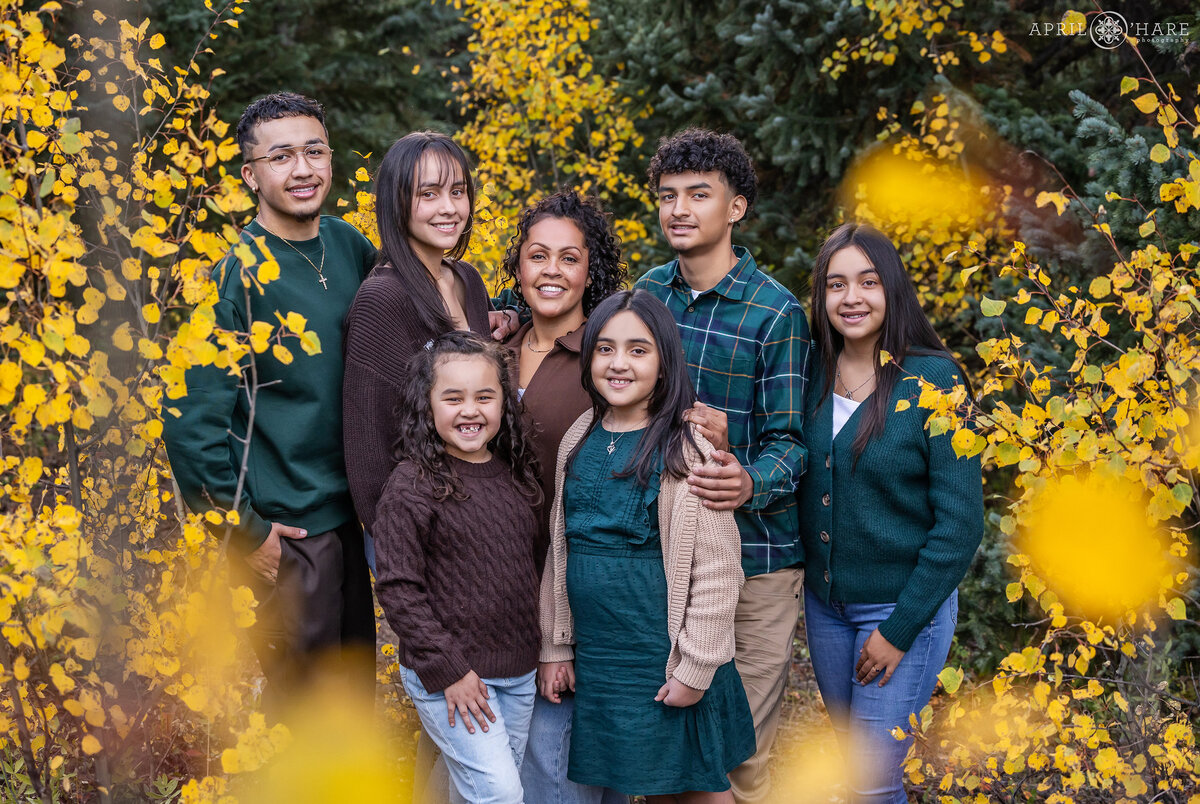 Fall Color Family Photo Surrounded by Aspen Leaves in Colorado