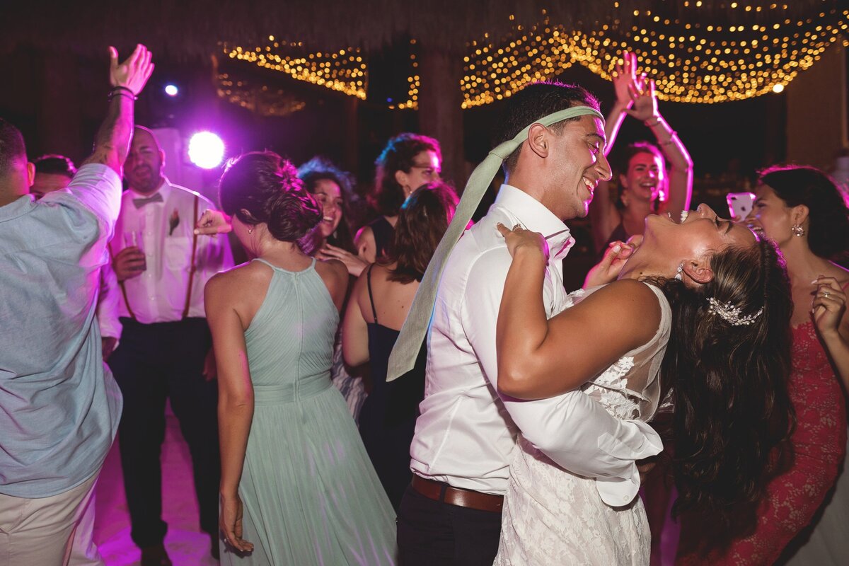 Bride and groom dancing at wedding reception in Cancun