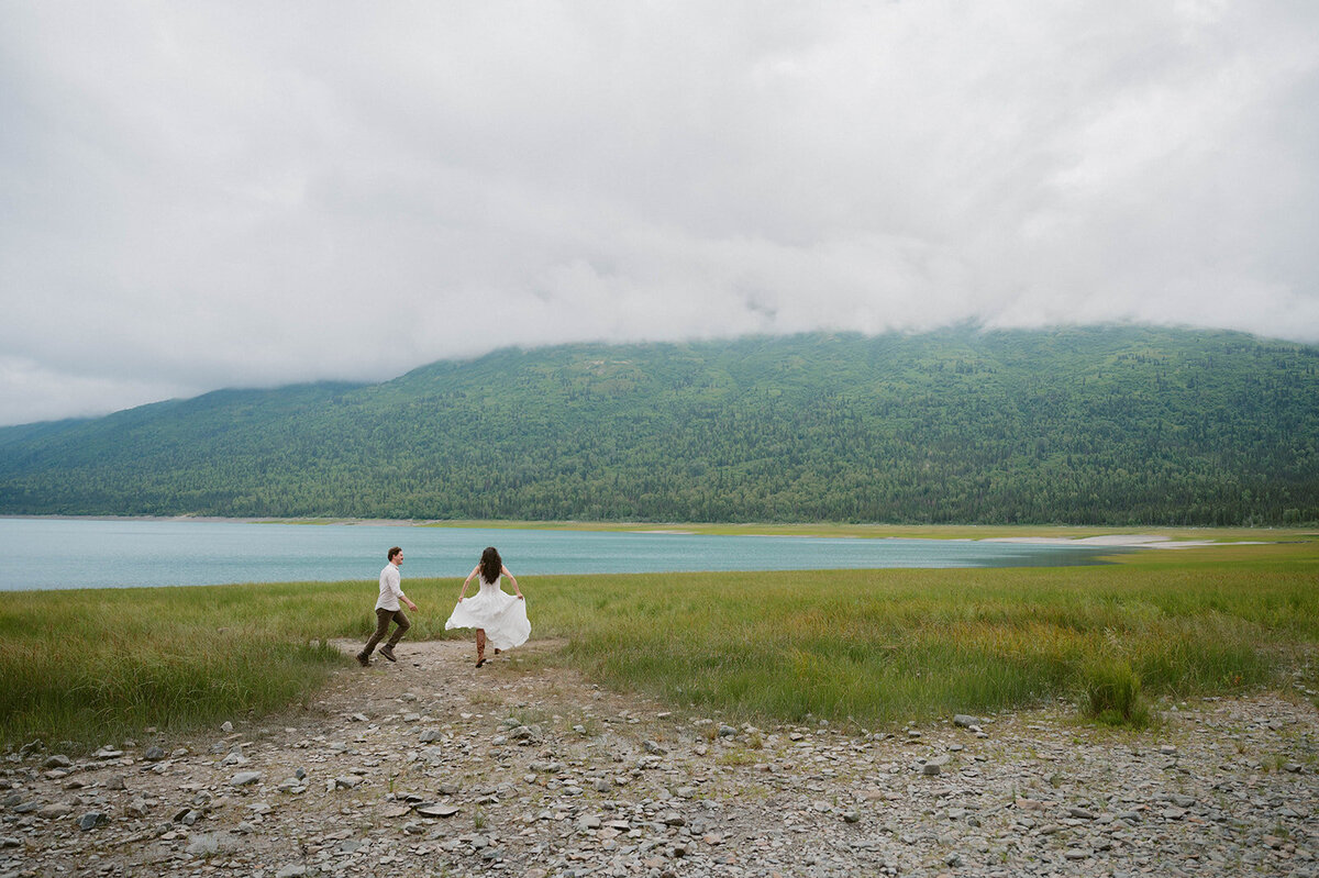 couple hopping around the lake