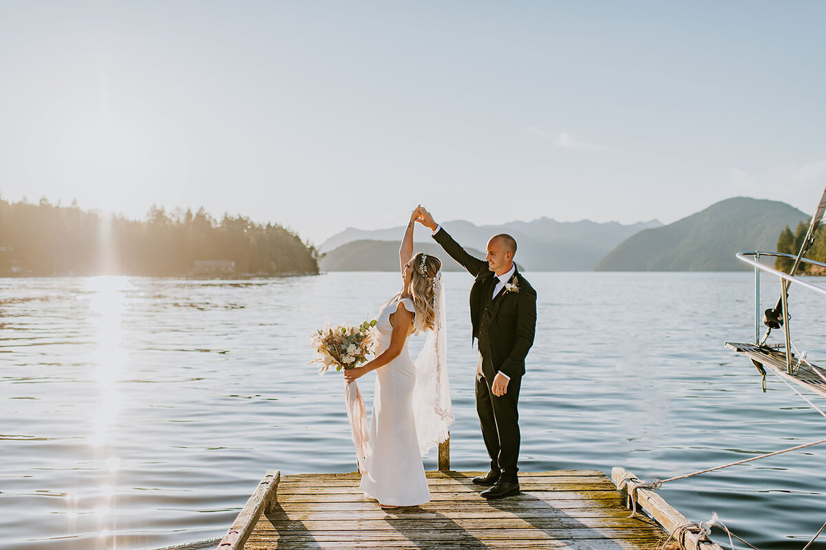 Couple during their ceremony during their elopement at the West Coast Wilderness Lodge on the Sunshine Coast B.C