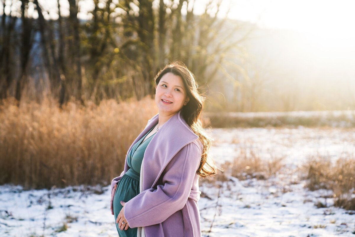 Seattle maternity photography, woman in coat at sunset in winter in Snoqualmie, Wa