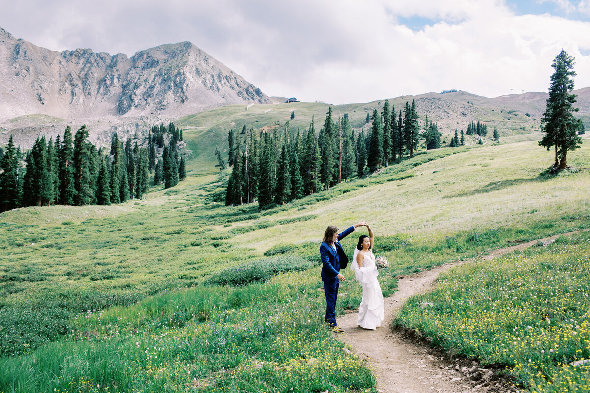 Wedding couple dance in field at a Keystone Colorado wedding
