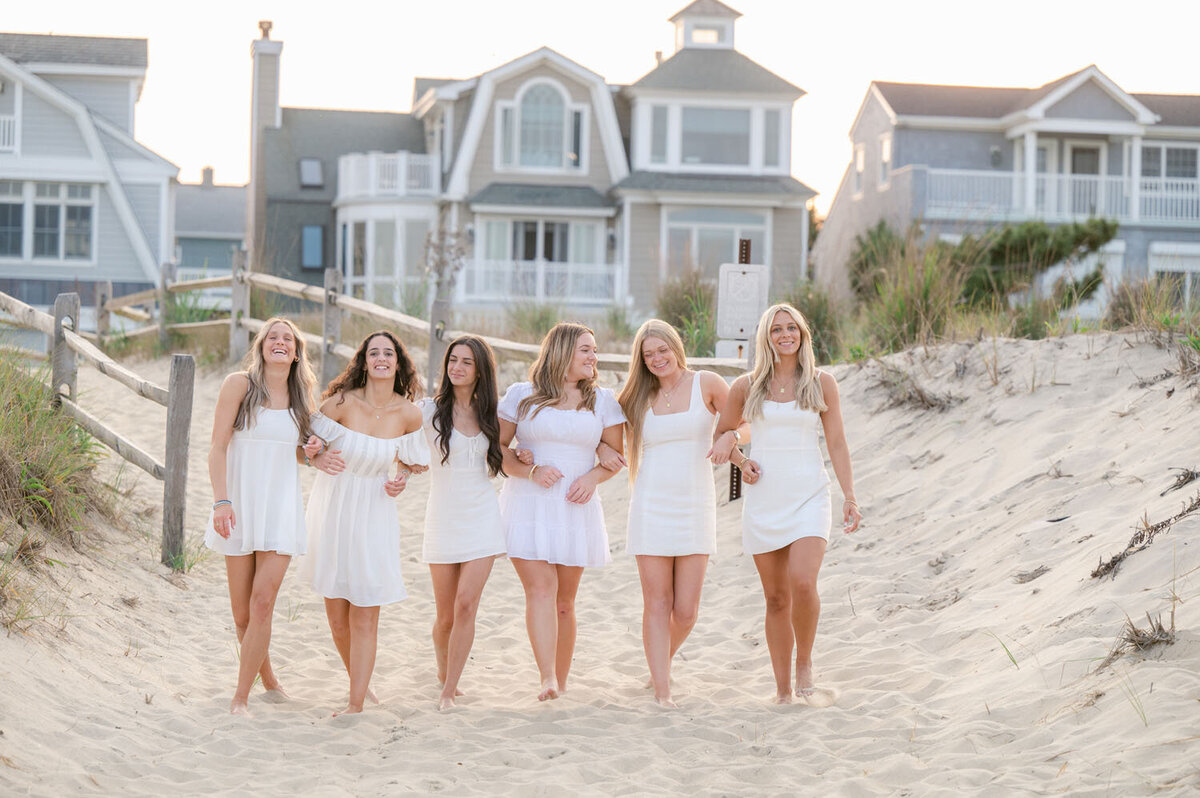 NJ senior photoshoot fun friends shoot cap and gown spring lak sea girt beach shoot white dresses-377