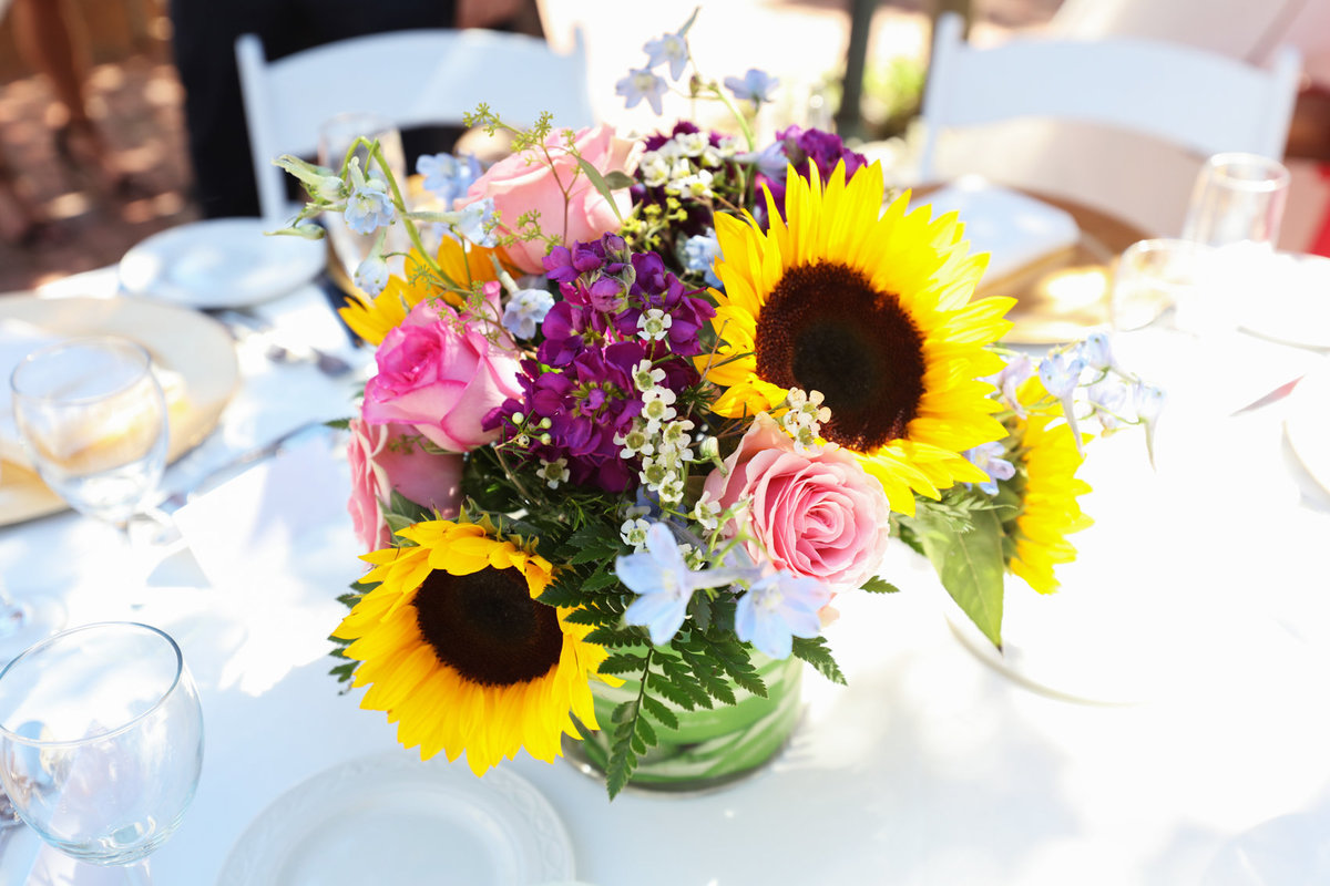 Close-up portrait of bouquet sunflowers centerpiece for reception