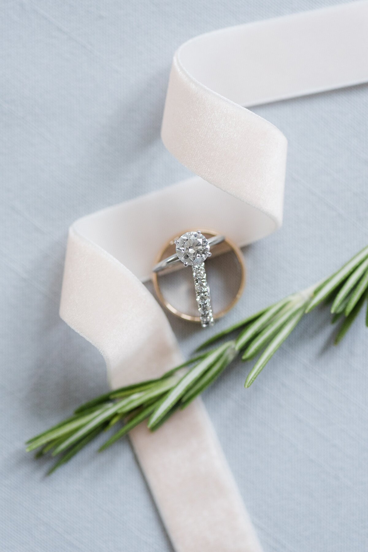 1_wedding-rings styled-with-blush-ribbon-and-rosemary _1033