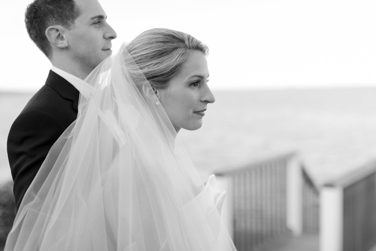 Bride and Groom overlook water during wedding at Wequassett.