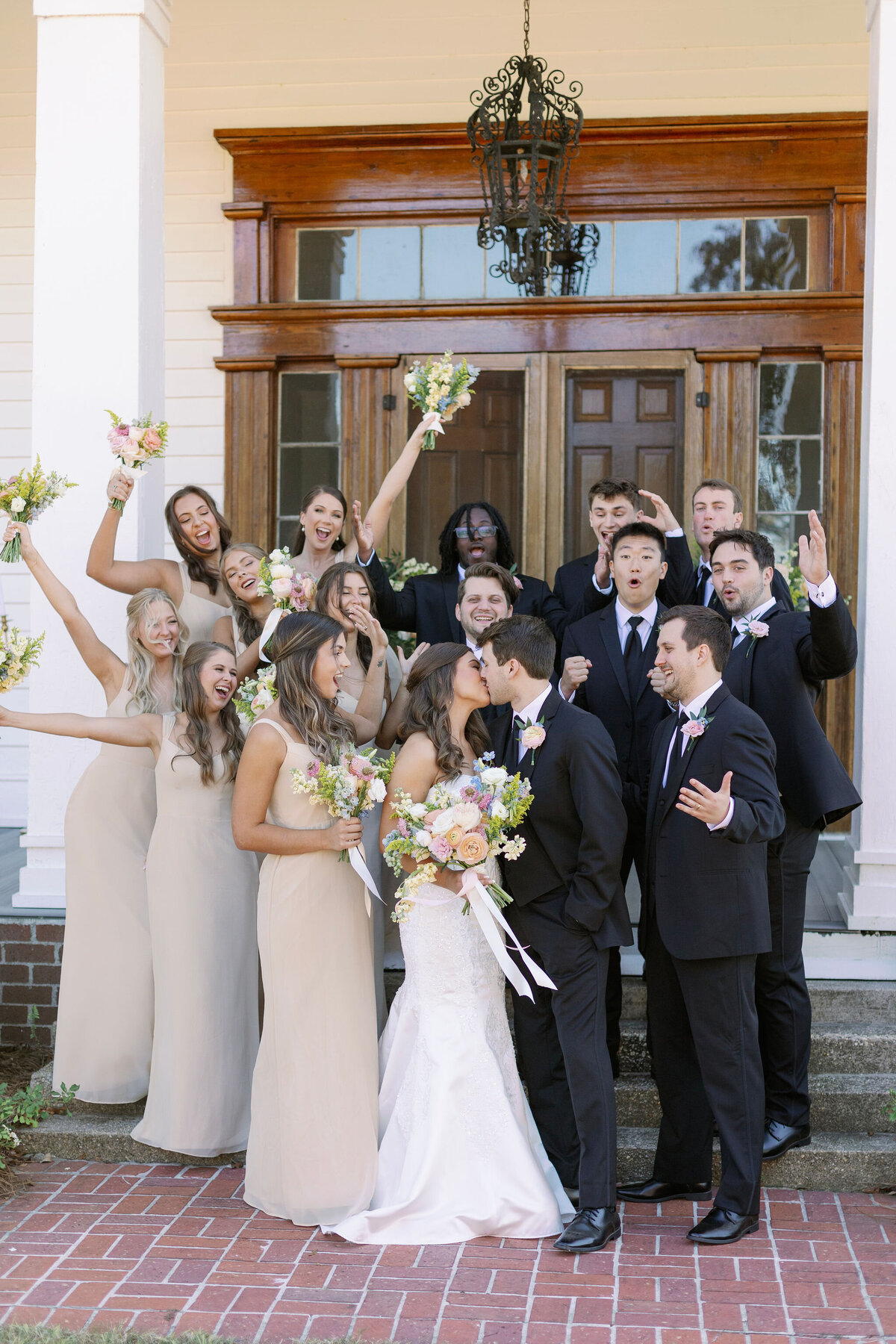 Bridal party celebrating with bride and groom