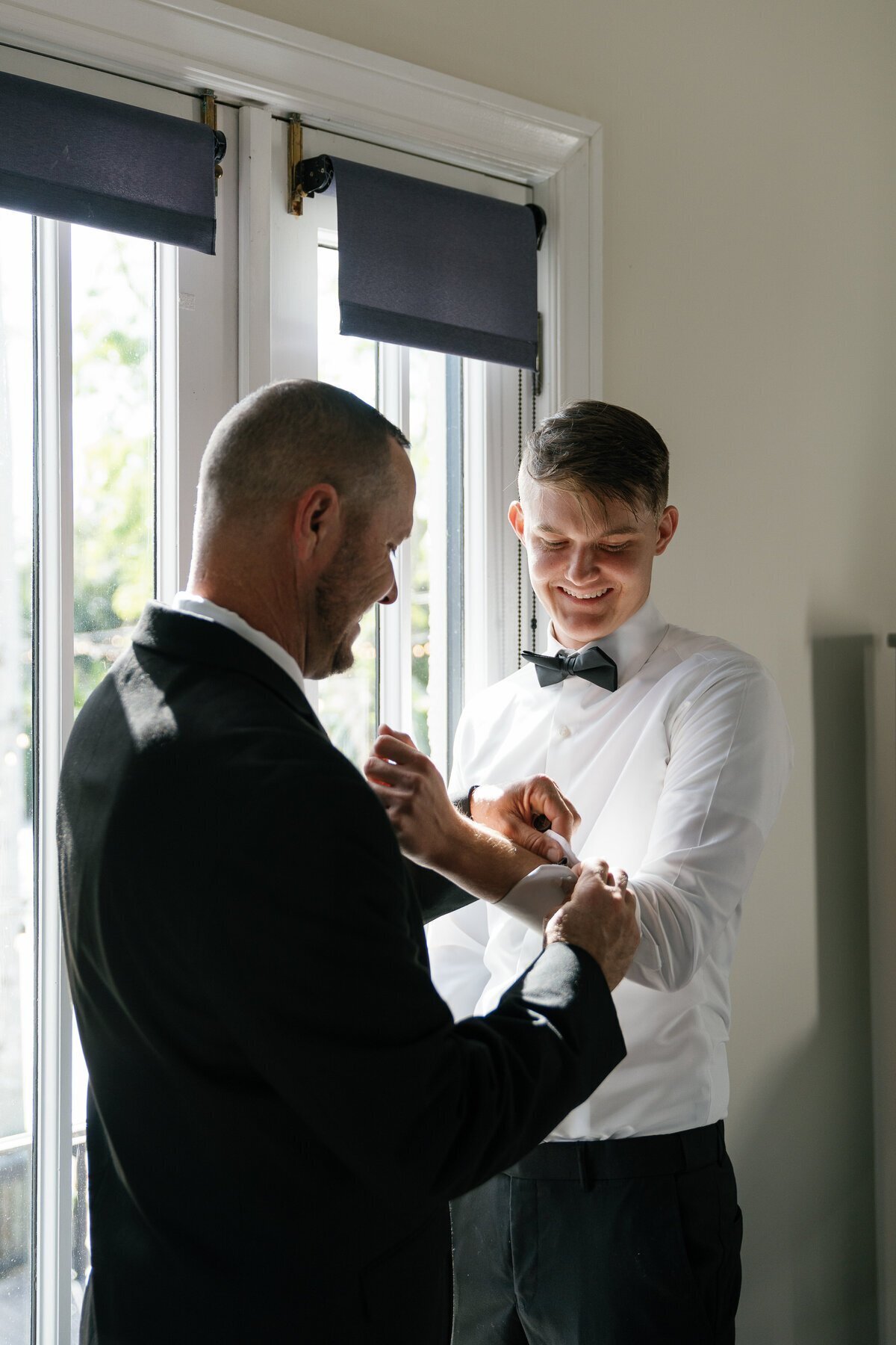 Groom with groomsmen taken by Shelby Ann Photos, film wedding photographer