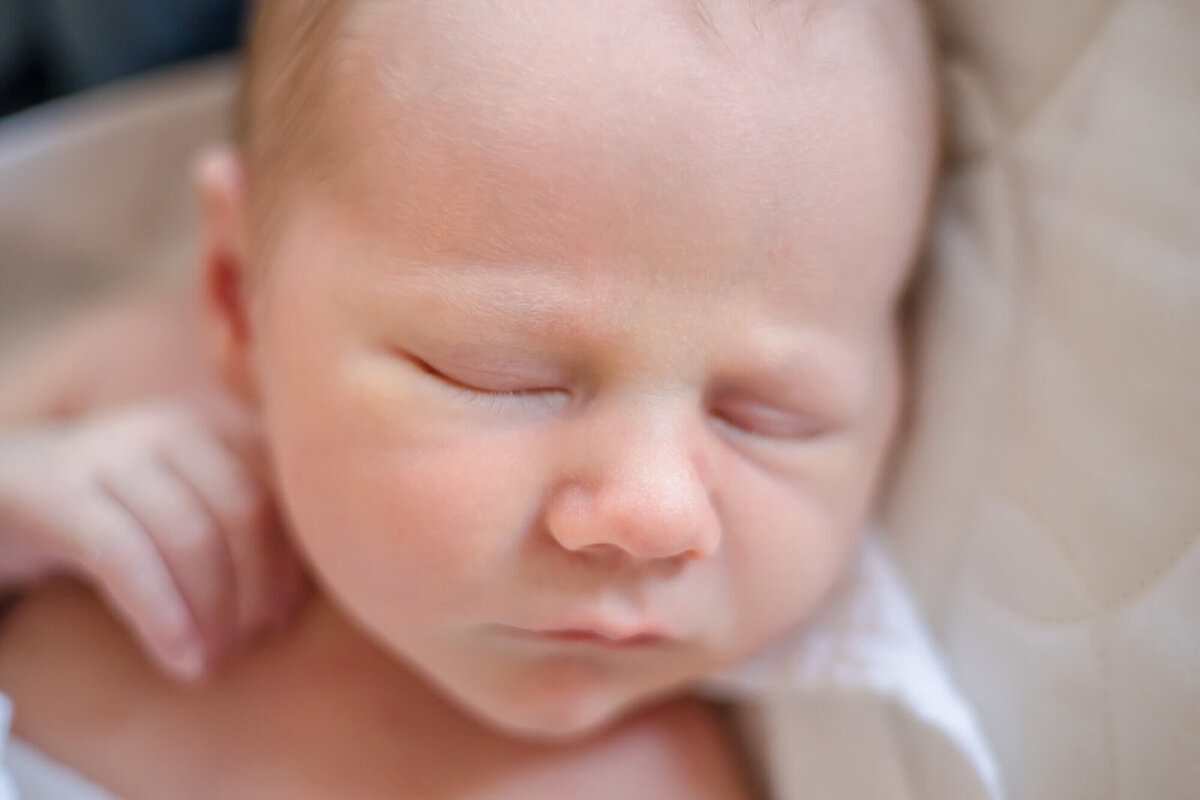 Close up of Newborn baby boy's face as he is sleeping