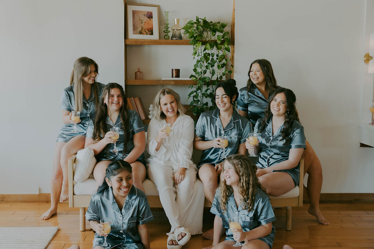 Bridesmaids in robes relaxing before the wedding at Uliana Estate, Lakeland FL.