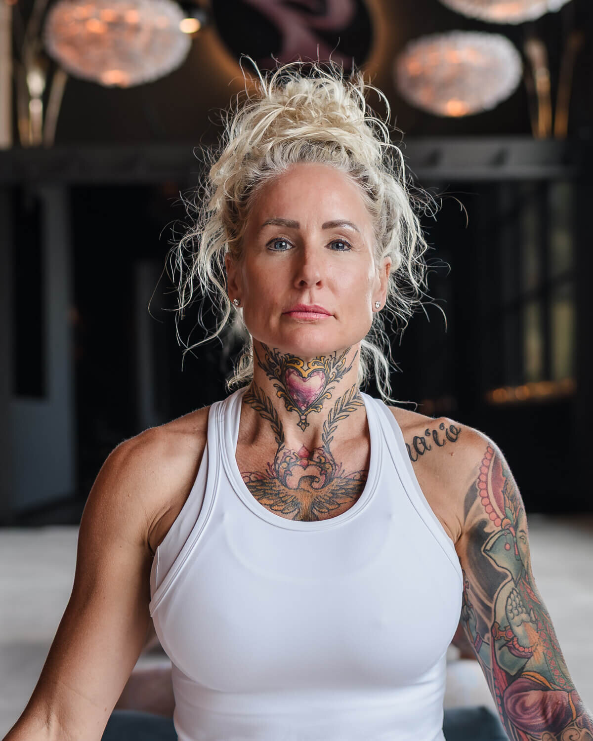 powerful woman in yoga studio looking directly at camera for modern headshot