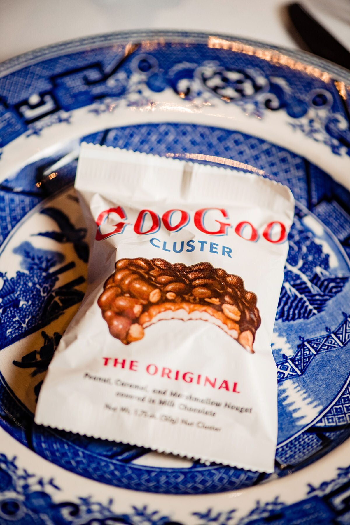 The original Goo Goo cluster candy on a vintage blue and white china plate.