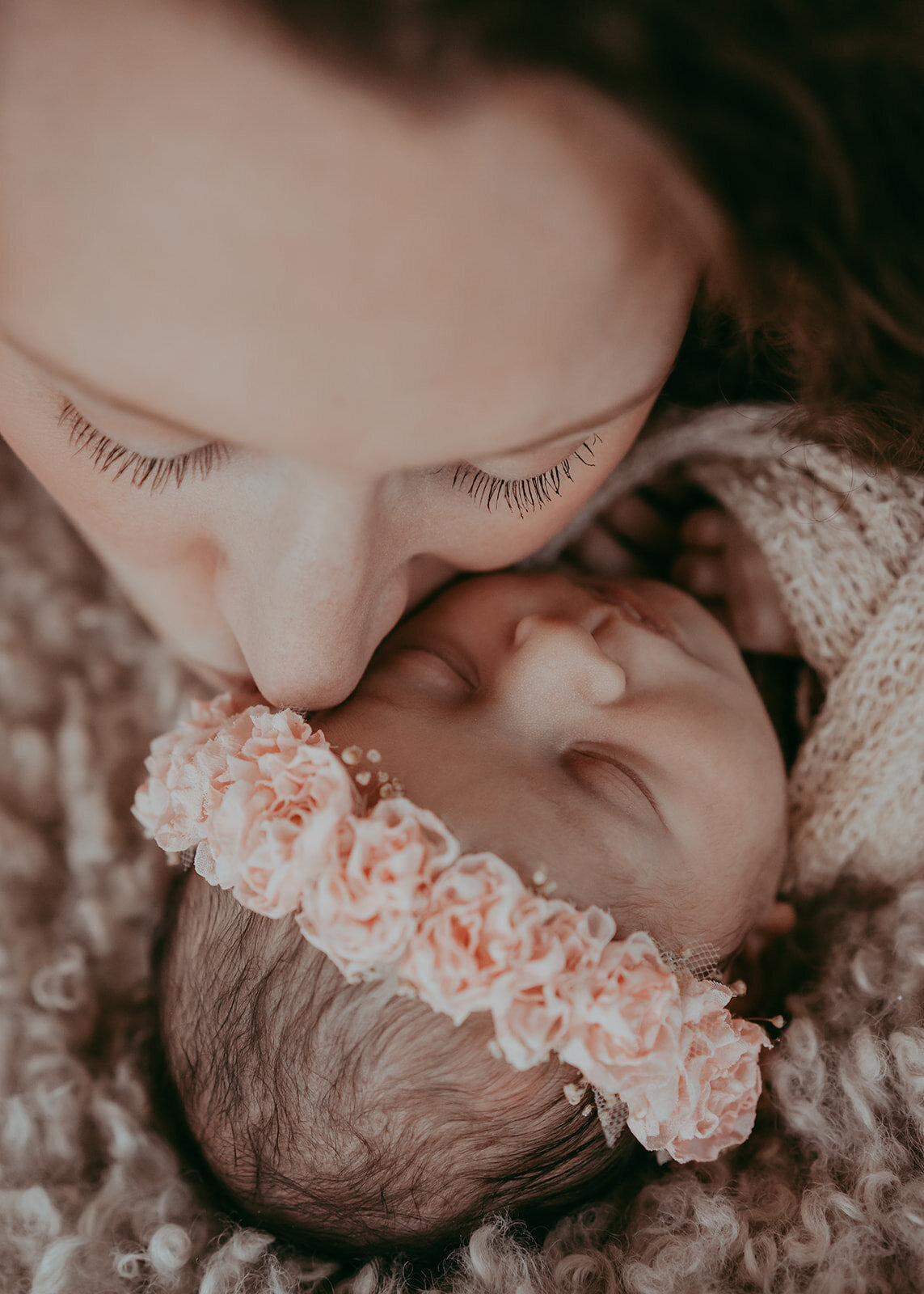 fine art portrait of newborn baby girl wearing flower crown
