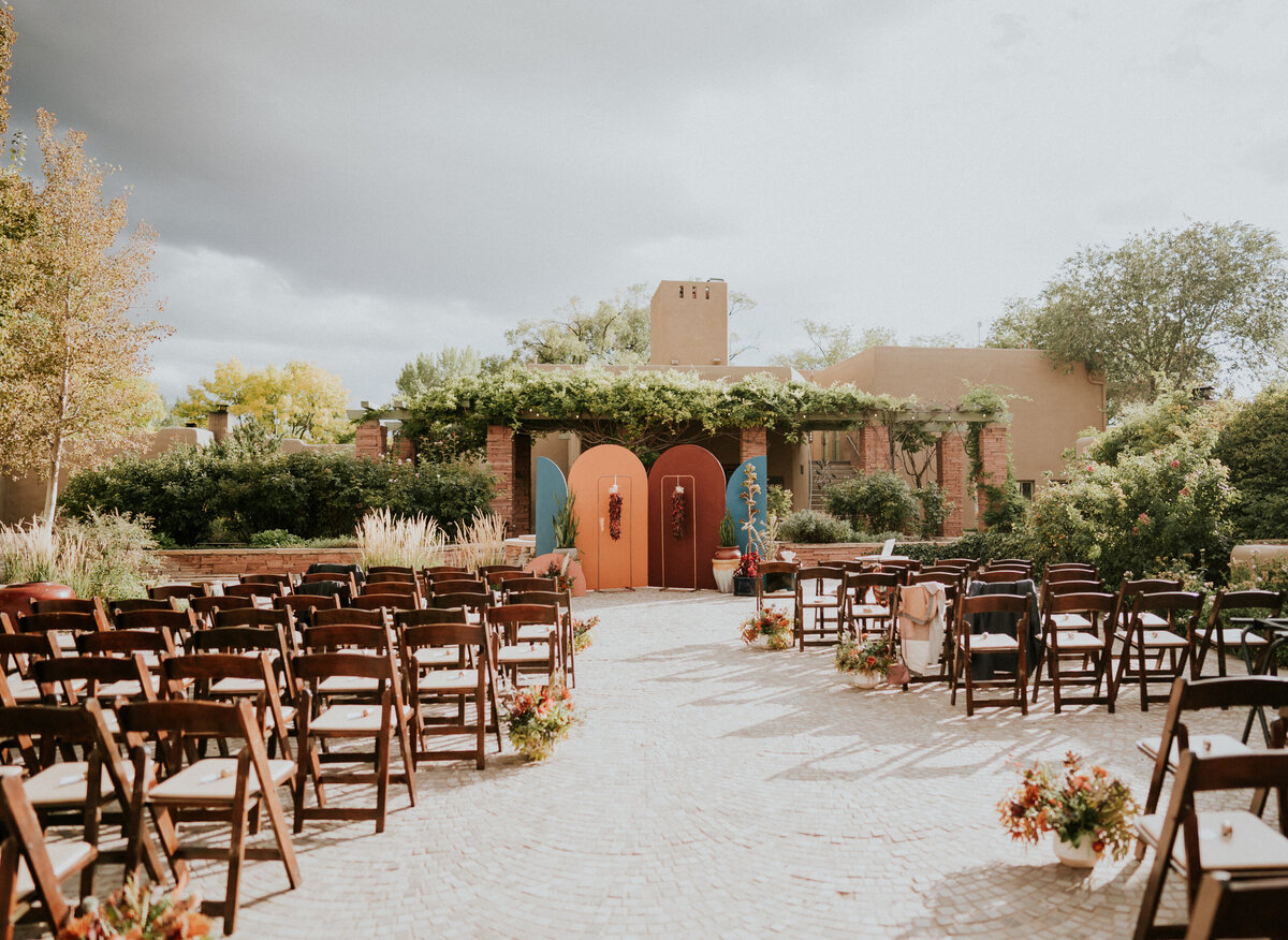 Wedding ceremony  with a southwestern  backdrop in Santa Fe New Mexico.