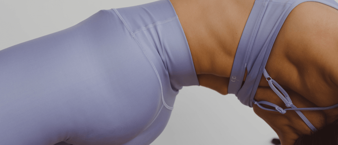 Women doing a backend in workout clothes posing
