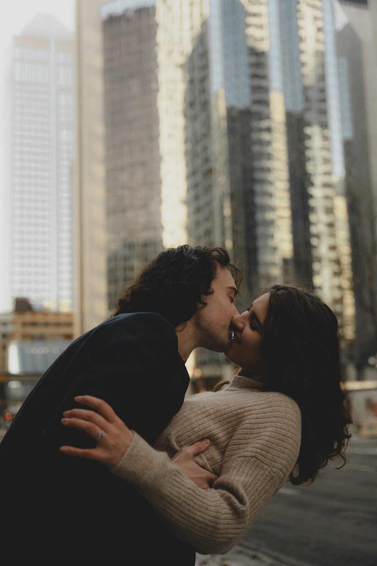 Couple nearly kissing in downtown Calgary, Alberta