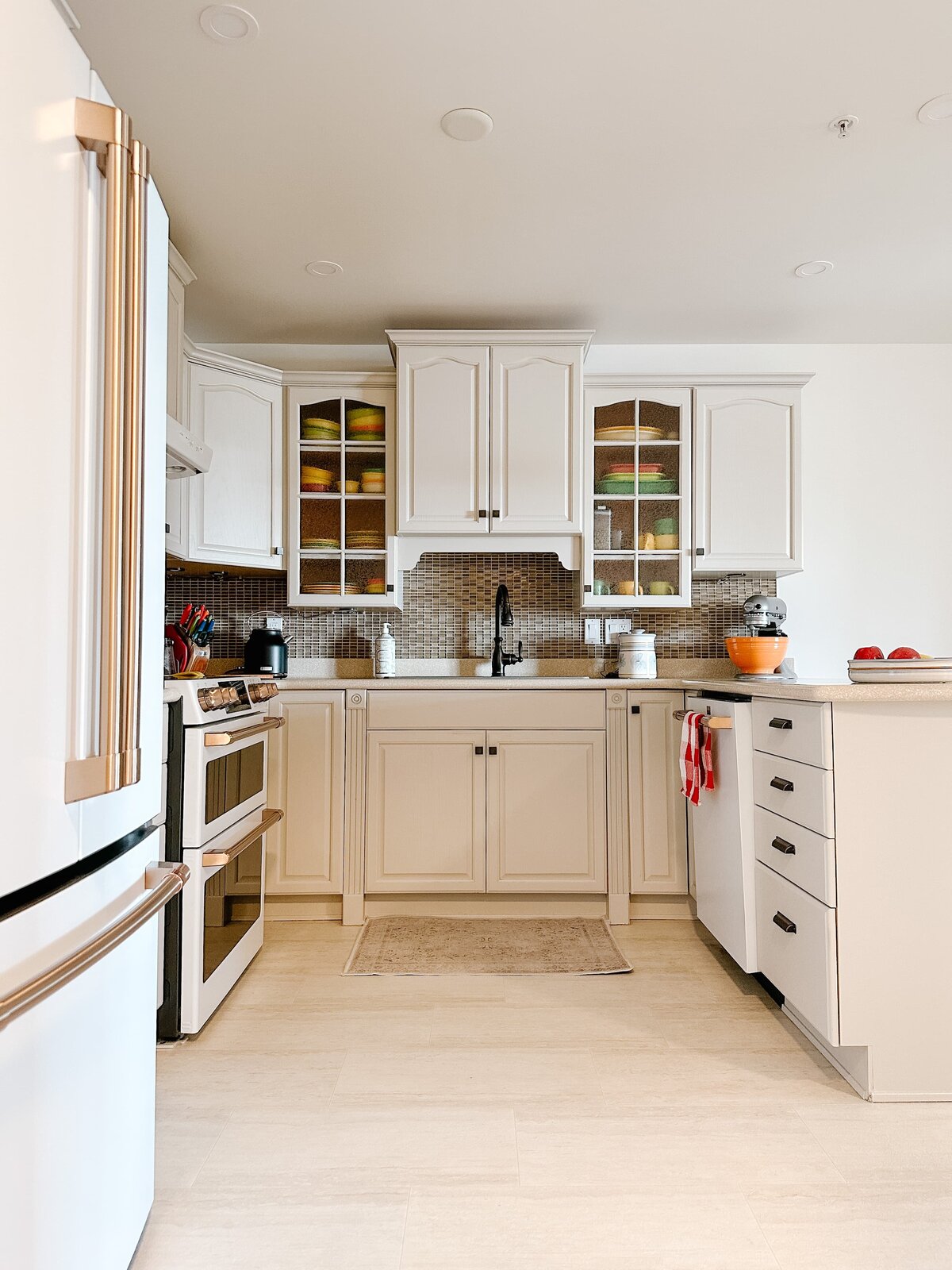 Traditional kitchen renovation with pendant lighting, dining nook and cafe appliances by Hanbury Design Co.