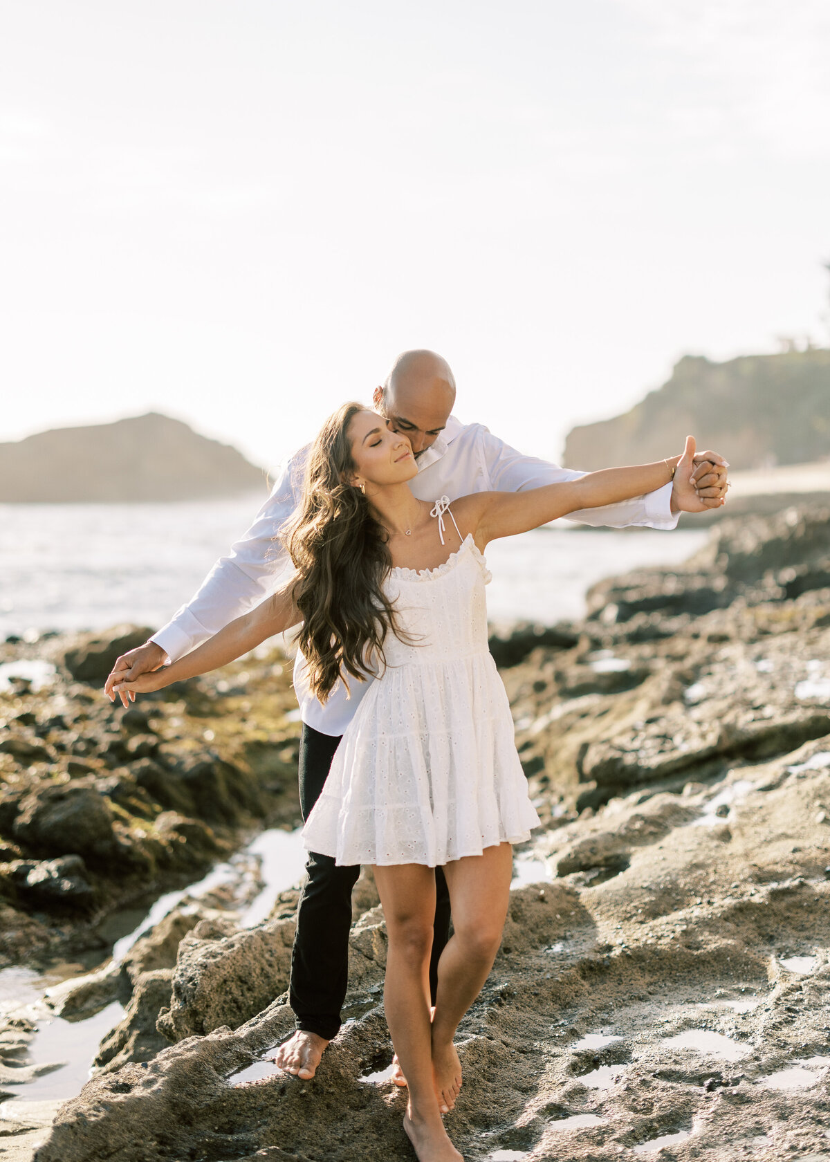 romantic carefree beach engagement photo