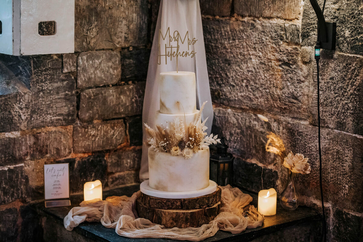 A wedding cake sitting on top of a table