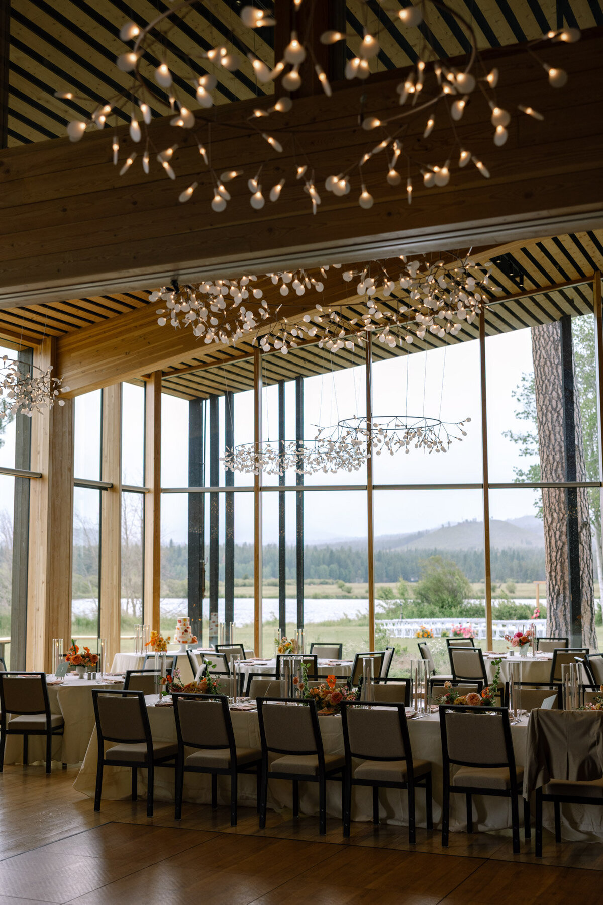 Modern wedding venue with views of the three sisters featuring wedding tables representing full service design and calligraphy by Life in Letters.