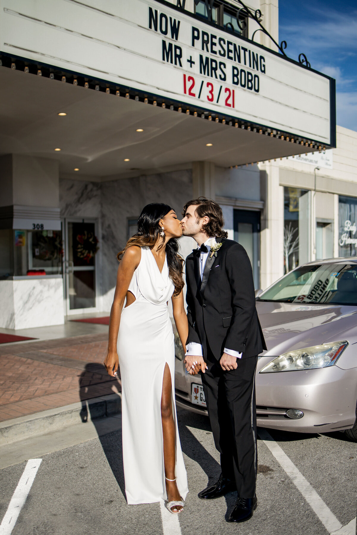bride and groom outside reception venue