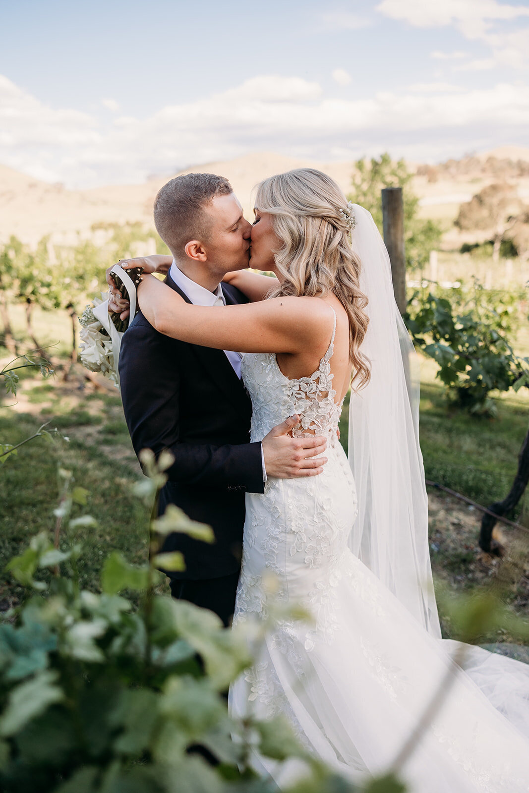 Bride and groom photography amongst the vines at Brindabella Hills Winery, Wallaroo NSW