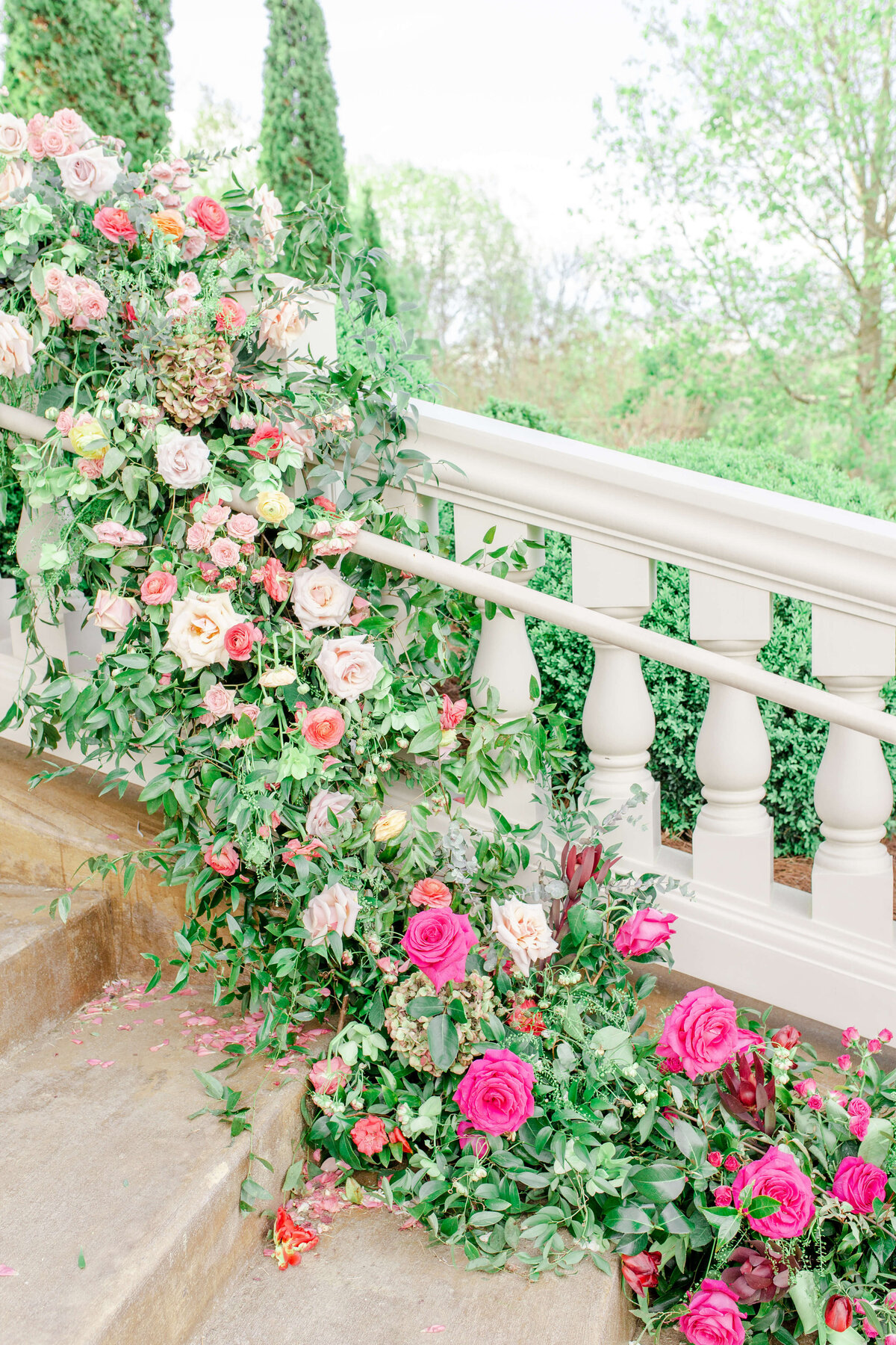 Wedding-Flowers-trailing-down-stairs-railing-Bethany-Lane-Photography