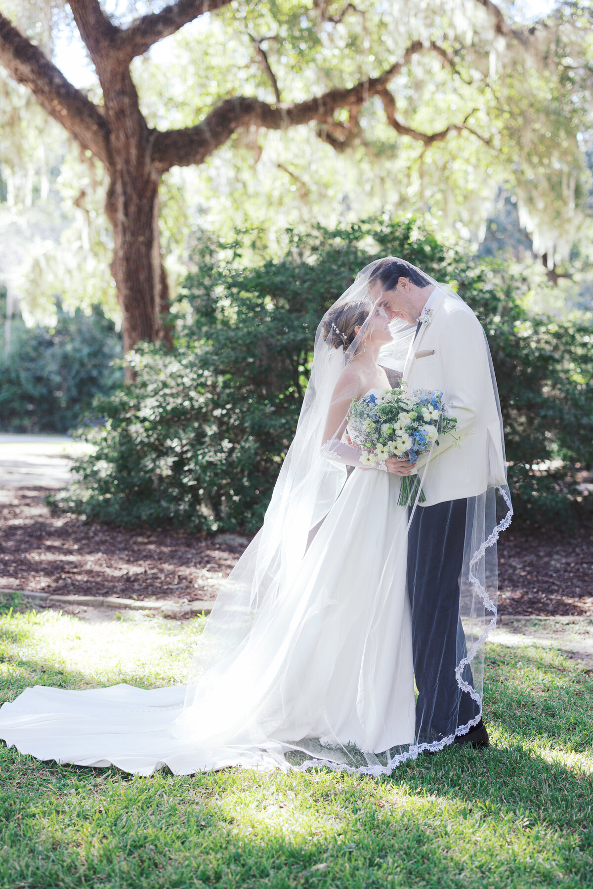 Bride and groom under the veil at Wingate Place