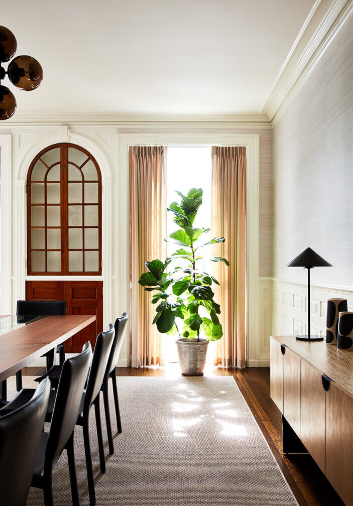 Modern interior design in Boston updates this historic home with contemporary furnishings, refined materials, and classic architectural details.