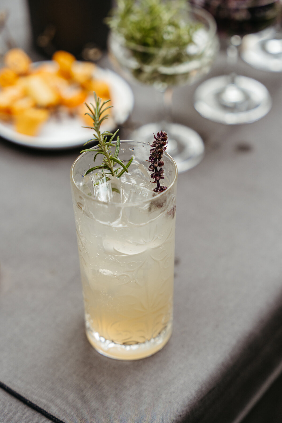 Herb-infused lemonade served in tall glass