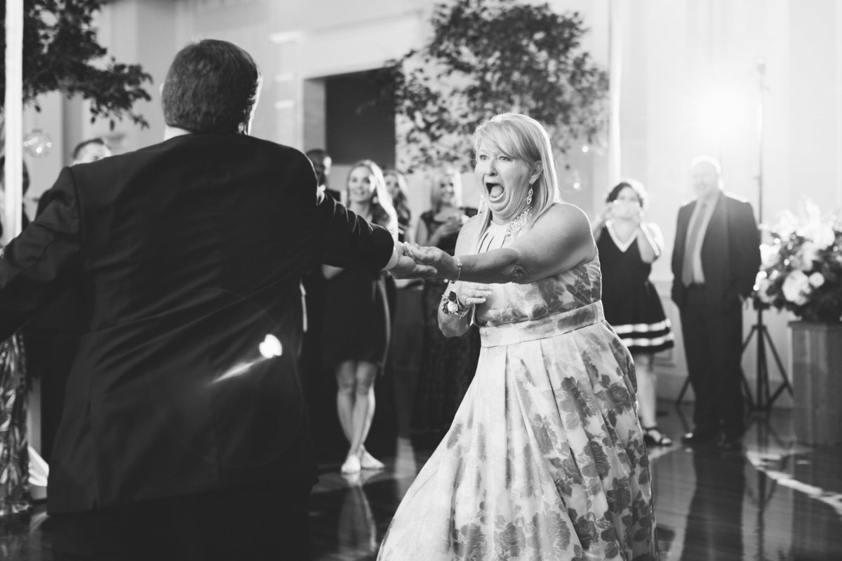 When the music hits and no one is ready for your surprise mother-son dance! Photo by luxury destination wedding photographer Rebecca Cerasani.