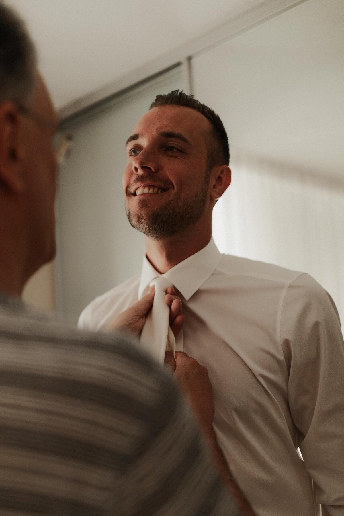 groom-getting-ready-with-father
