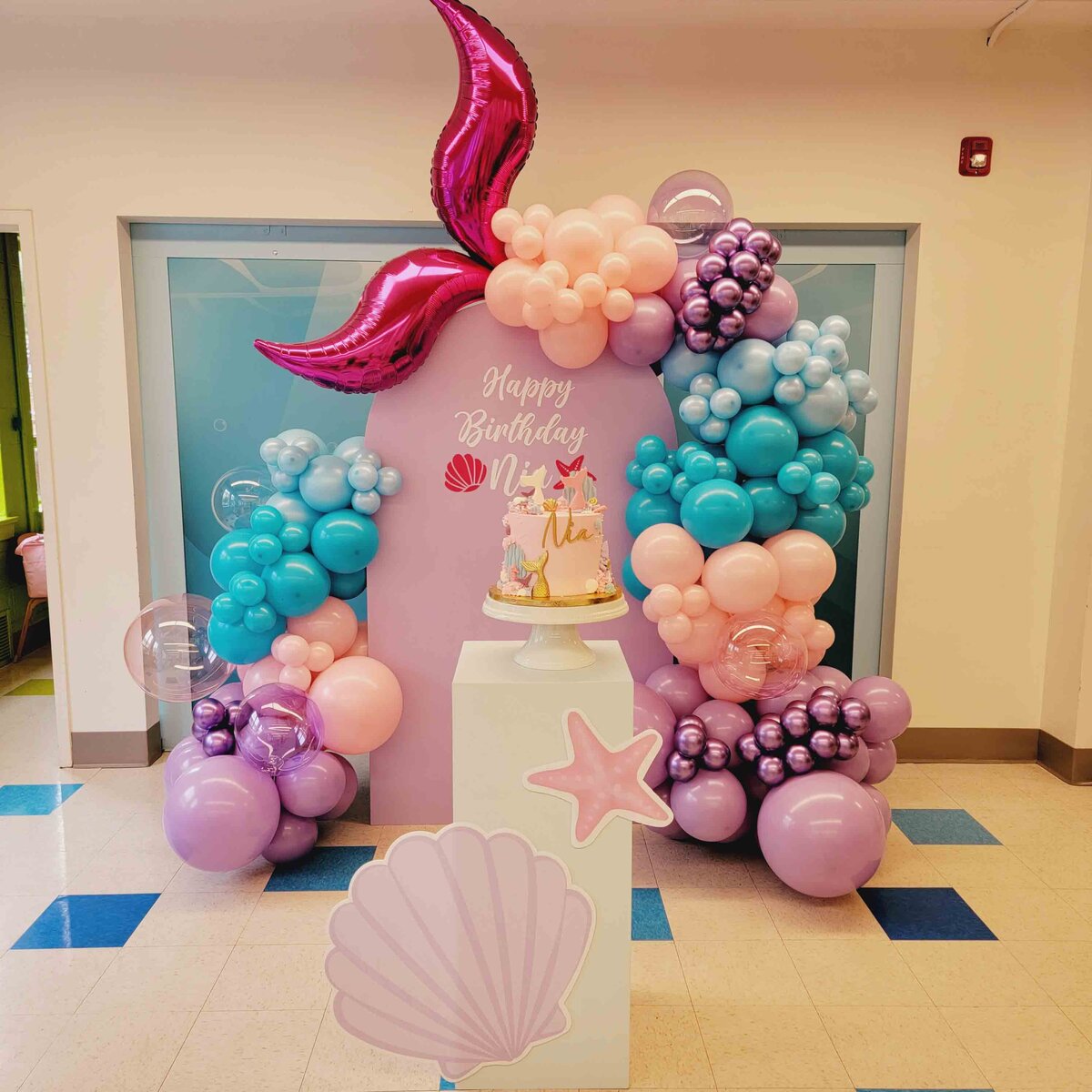 The celebration into an enchanting underwater realm with Air with Flair Decor's Custom Balloon Installation, featuring Little Mermaid and Sea Party magic.
